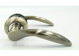 Ручка Trion на круглой розете  Pietra  ЦАМ AB/CP Armadil бронза/хром